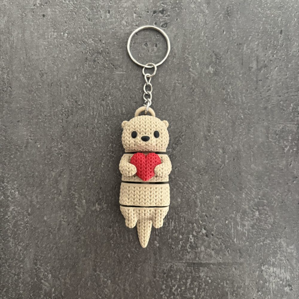 Otter mit Herz im Strickmuster