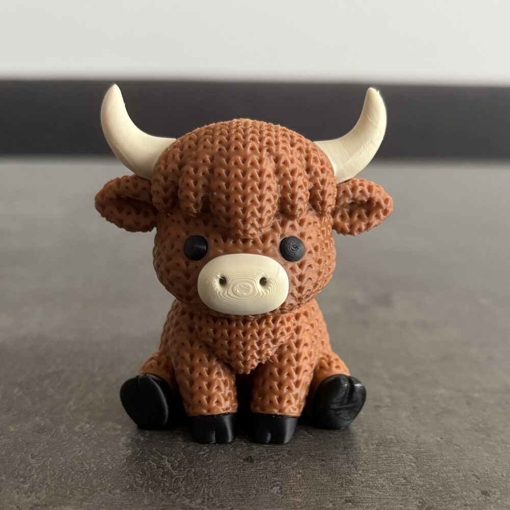 Highland Kuh im Strickmuster